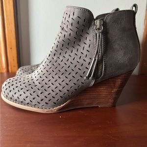 Dark gray wedge booties.
